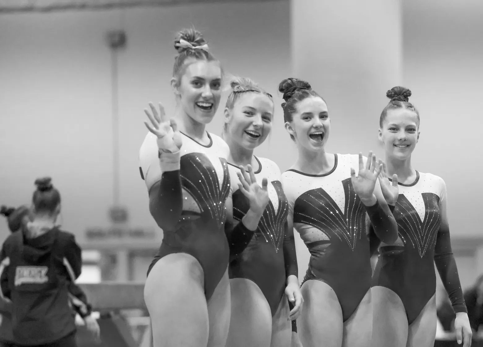 Chow's gymnastics team together at a meet